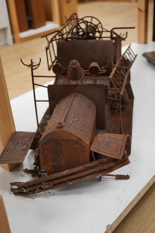 A skeleton of a toy vehicle 80cm long. Condition - rusty, without wheels